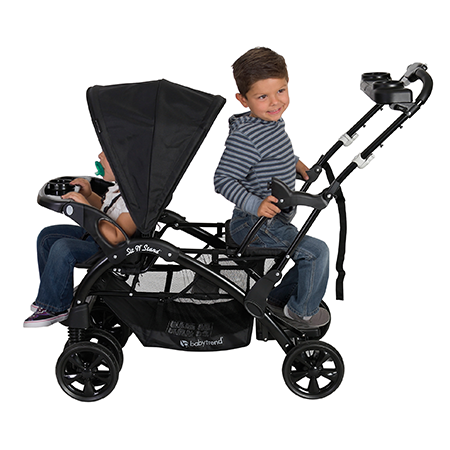 Placing one child in the stroller seat and the other one standing